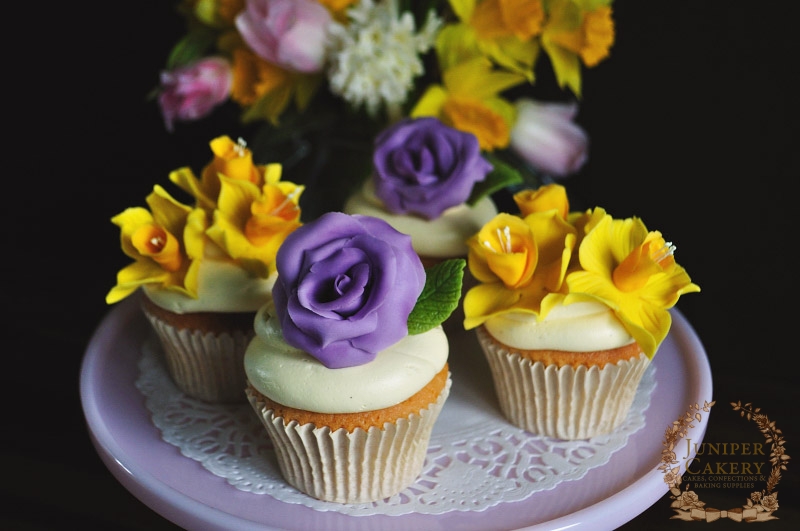 Daffodil and rose adorned cupcakes by Juniper Cakery