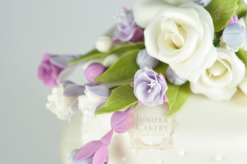 Beautiful rose and fuchsia cupcake and cake wedding tower by Juniper Cakery