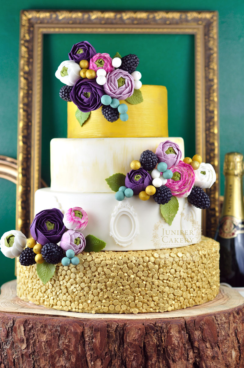 Beautiful gold ranunculus wedding cake by Juniper Cakery