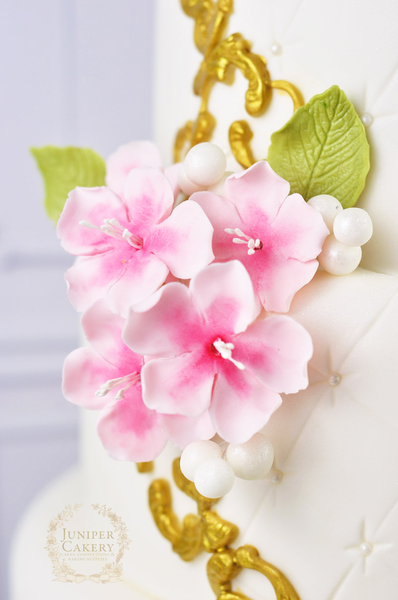 Pink cherry blossom with gold frame wedding cake by Juniper Cakery