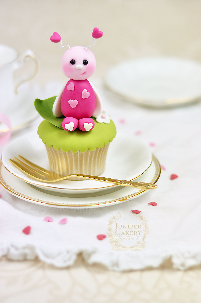 Valentine's Day cupcake decorating tutorial on how to make a cute edible love bug from Juniper Cakery