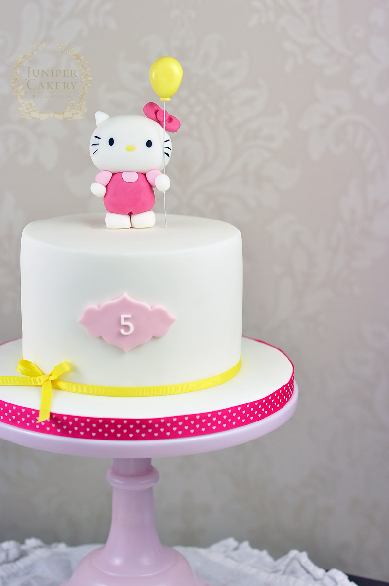 Pink and yellow Hello Kitty cake by Juniper Cakery