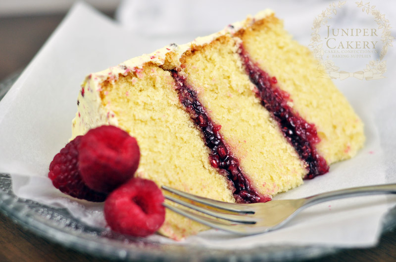 Slice of raspberry and pink peppercorn cake by Juniper Cakery