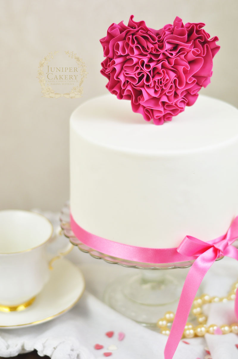 Tutorial on how to decorate a ruffle heart cake for Valentine's Day by Juniper Cakery