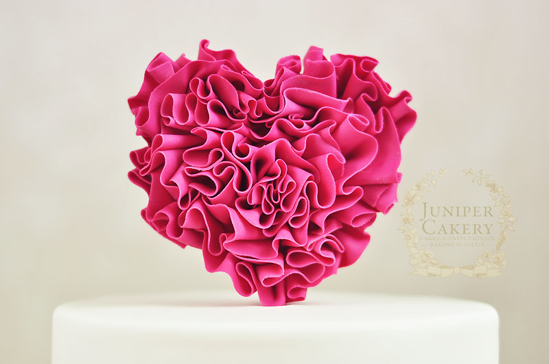 Tutorial on how to decorate a ruffle heart cake for Valentine's Day by Juniper Cakery