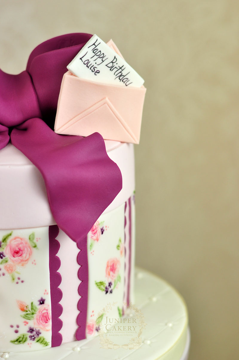 Purple, peach and blush vintage hat box cake by Juniper Cakery