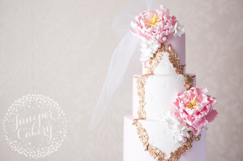 Pink Rococo inspired wedding cake with veil by Juniper Cakery