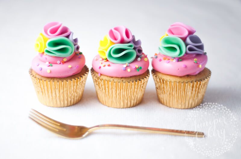 Rainbow pom pom cupcakes tutorial for parties by Juniper Cakery