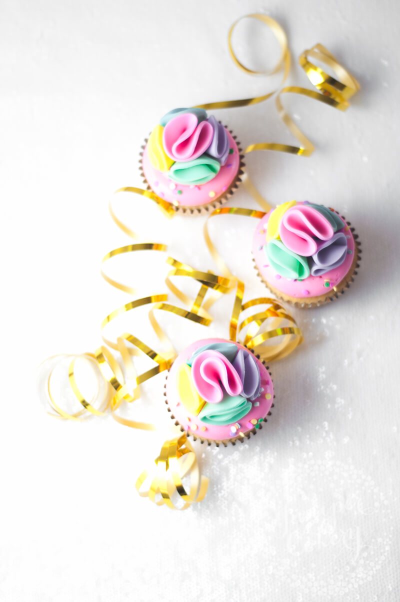 Unicorn rainbow pom pom cupcakes by Juniper Cakery