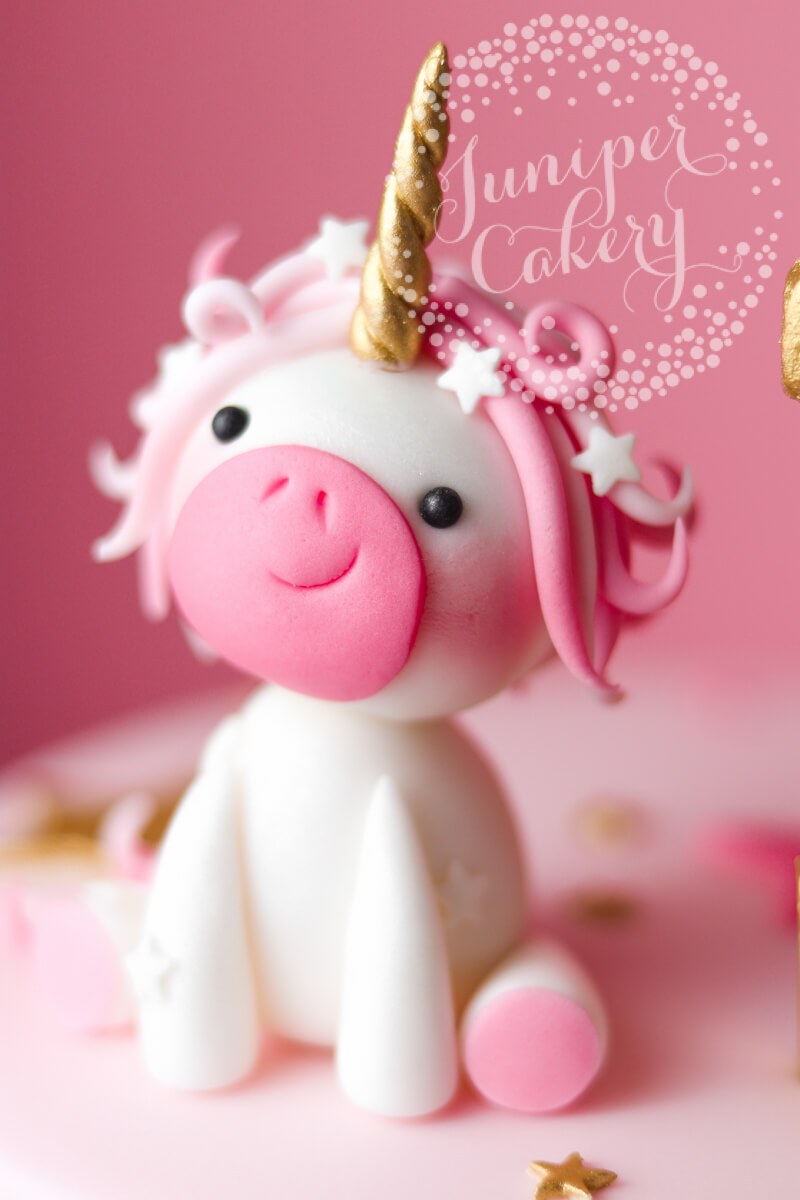 Adorable pink fondant unicorn by Juniper Cakery