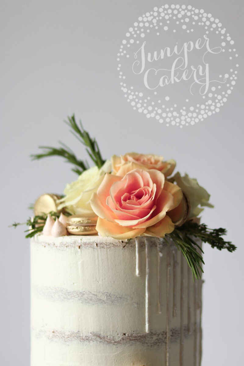 Pretty white on white semi-naked cake by Juniper Cakery