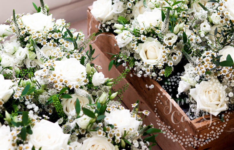 White wedding florals by The Wedding and Flower Boutique