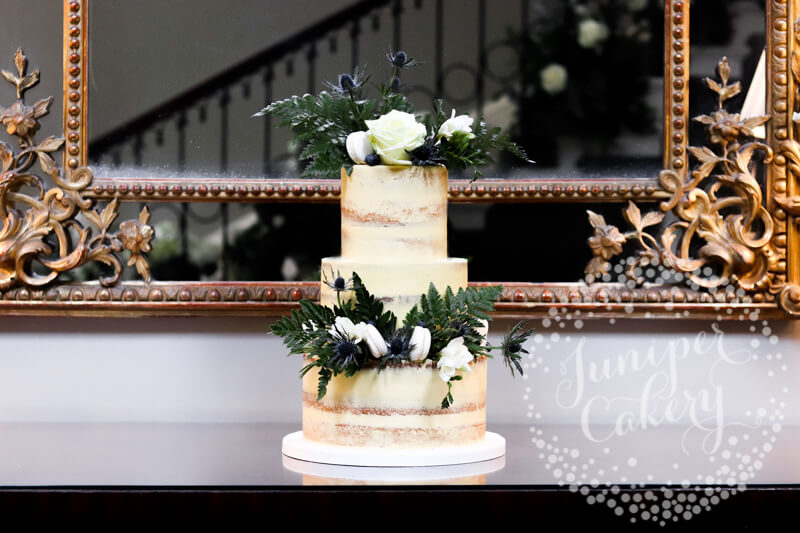 Wild and chic thistle semi-naked wedding cake at Saltmarshe Hall by Juniper Cakery